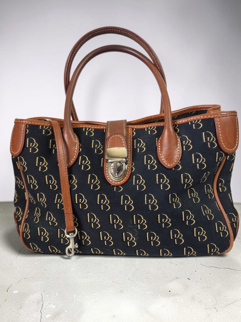 Dooney & Bourke Black Monogram Satchel with Brown Leather Trim